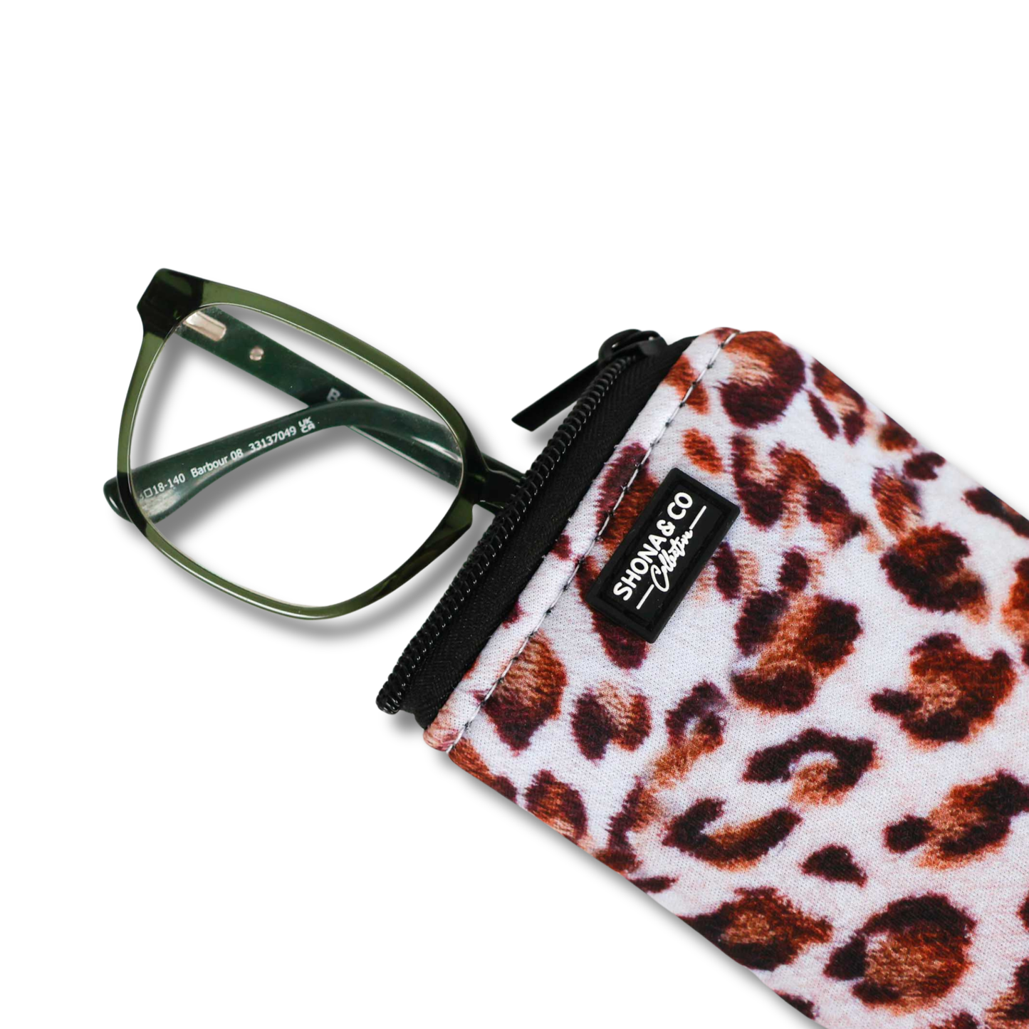 Leopard print glasses case with green glasses on a white background